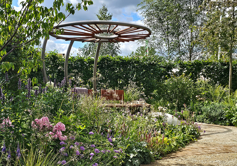 Metal structure amongst a blooming garden