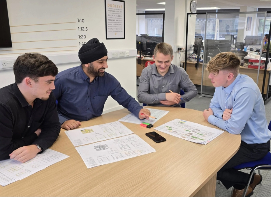 candid team photo at desk