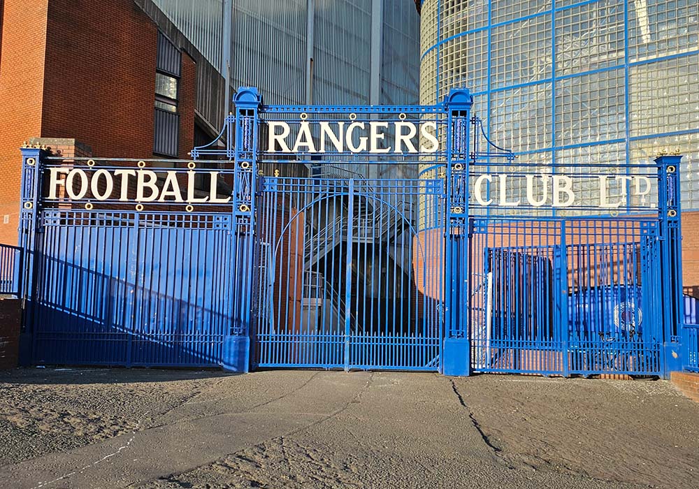 Blue gate with Rangers Football Clu in white