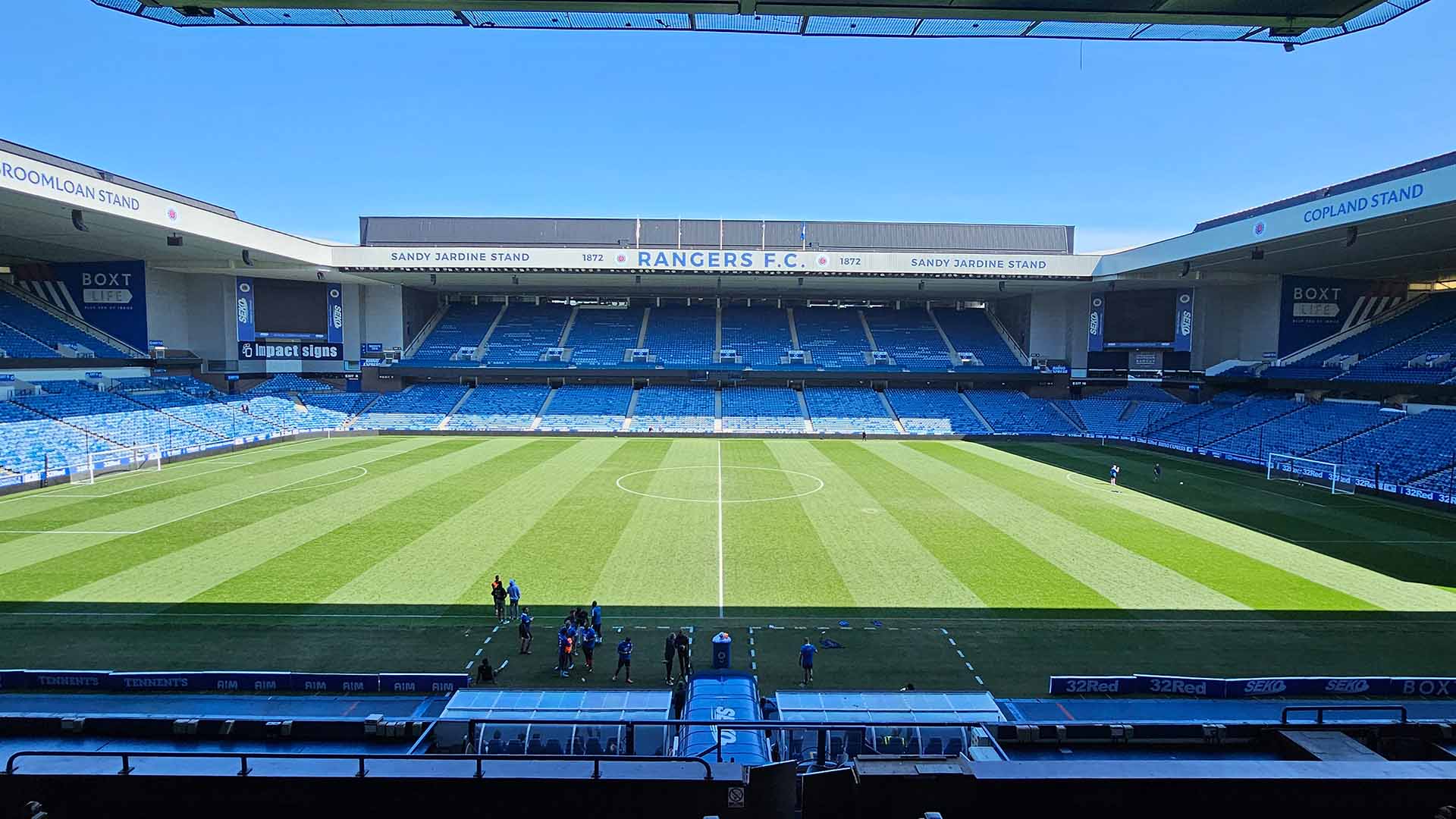Stadium shot with pitch and stands