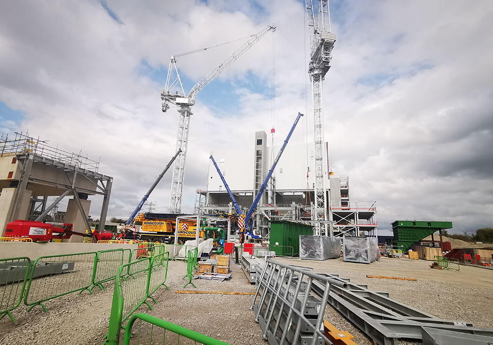 Cranes and steel frames on ground