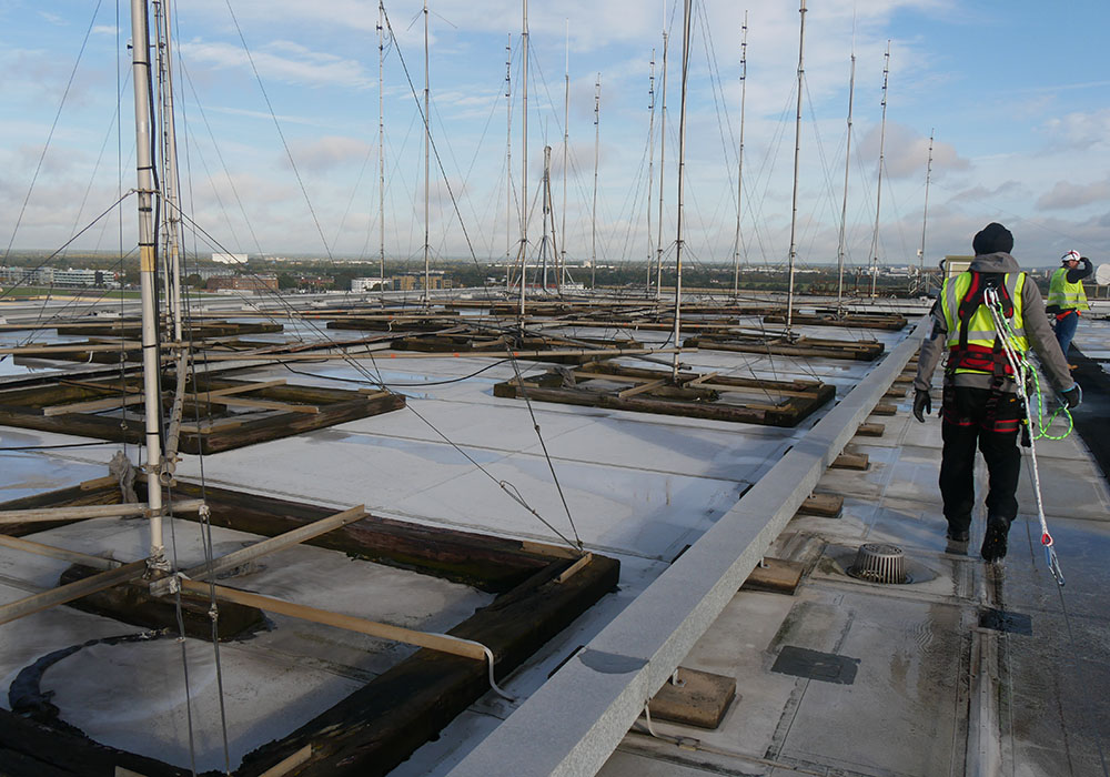 Engineer in harness on roof